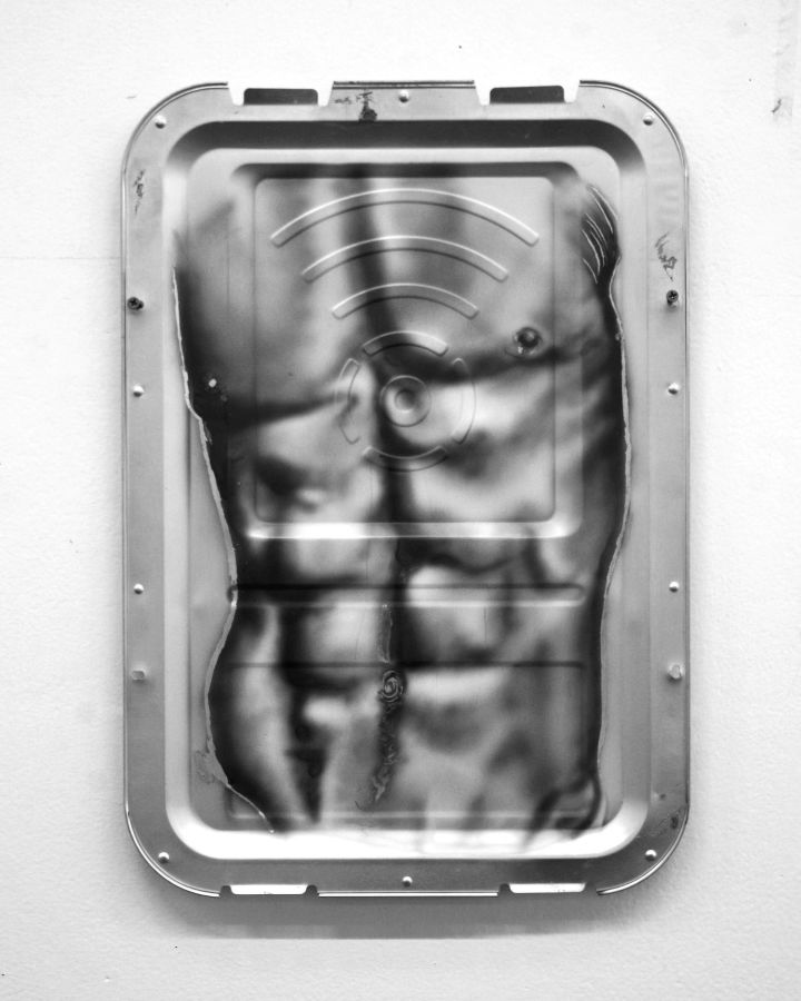 Washboard (2023), airbrushed on found watching machine part.